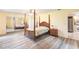Spacious bedroom with wood flooring and mirrored closet at 2216 Pellam Blvd, Port Charlotte, FL 33948