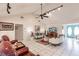 Living room with high ceilings, a ceiling fan, and hardwood floors at 2216 Pellam Blvd, Port Charlotte, FL 33948