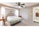 Comfortable bedroom with a queen bed, ceiling fan, and built-in closet at 2216 Pellam Blvd, Port Charlotte, FL 33948