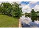 Serene waterfront property with lush landscaping and canal views at 2216 Pellam Blvd, Port Charlotte, FL 33948