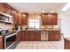 View of kitchen with stainless steel appliances and granite counters at 2216 Pellam Blvd, Port Charlotte, FL 33948