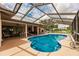 Spacious pool area with screened enclosure, providing shade and privacy at 2216 Pellam Blvd, Port Charlotte, FL 33948