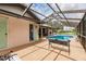 Enjoy this refreshing pool area with screened enclosure and relaxing bench at 2216 Pellam Blvd, Port Charlotte, FL 33948