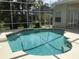 Inviting kidney-shaped pool with screened enclosure at 1292 W Hillsborough Blvd, North Port, FL 34288