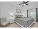 Main bedroom with a king-size bed, gray bedding, and ceiling fan at 14194 Heritage Landing Blvd # 624, Punta Gorda, FL 33955