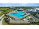 Community pool and clubhouse with tennis courts nearby at 14194 Heritage Landing Blvd # 624, Punta Gorda, FL 33955