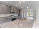 Modern kitchen with stainless steel appliances and granite countertops at 9461 Attica Cir, Port Charlotte, FL 33981