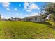 Spacious backyard with two houses visible at 9461 Attica Cir, Port Charlotte, FL 33981