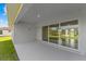 Covered patio with sliding glass doors leading to backyard at 9461 Attica Cir, Port Charlotte, FL 33981