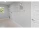 Laundry room with shelving and tile flooring at 9461 Attica Cir, Port Charlotte, FL 33981