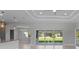 Bright living room with sliding glass doors and high ceilings at 9461 Attica Cir, Port Charlotte, FL 33981