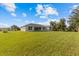 Large backyard with lush green grass at 9461 Attica Cir, Port Charlotte, FL 33981