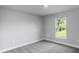 Spacious bedroom with neutral carpeting and large window at 9461 Attica Cir, Port Charlotte, FL 33981