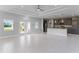 Open living room and kitchen with tile flooring and modern finishes at 9461 Attica Cir, Port Charlotte, FL 33981