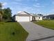 House exterior with driveway and landscaping at 9461 Attica Cir, Port Charlotte, FL 33981