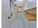 Laundry room with built-in cabinets, shelving, and washer/dryer hookups at 286 Mark Twain Ln, Rotonda West, FL 33947