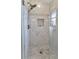 Modern walk-in shower with marble tile and glass enclosure at 286 Mark Twain Ln, Rotonda West, FL 33947