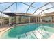 Inviting screened pool area with pavers and seating at 286 Mark Twain Ln, Rotonda West, FL 33947
