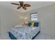 Guest bedroom with a queen-size bed and updated decor at 286 Mark Twain Ln, Rotonda West, FL 33947