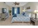 Main bedroom with king bed, dresser, and patio access at 286 Mark Twain Ln, Rotonda West, FL 33947