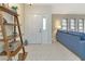 Bright entryway with tile flooring and wooden shelving at 286 Mark Twain Ln, Rotonda West, FL 33947