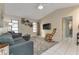 Living room featuring a sectional sofa, rocking chair, and an area rug at 286 Mark Twain Ln, Rotonda West, FL 33947