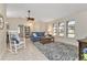 Spacious living room with vaulted ceiling and comfy seating at 286 Mark Twain Ln, Rotonda West, FL 33947