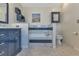 Bathroom with double vanity, soaking tub, and separate toilet at 286 Mark Twain Ln, Rotonda West, FL 33947