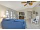 Spacious living room with vaulted ceiling and comfy seating at 286 Mark Twain Ln, Rotonda West, FL 33947