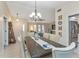 Spacious dining area with a table and chairs, adjacent to the living room at 286 Mark Twain Ln, Rotonda West, FL 33947