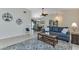 Spacious living room with vaulted ceiling and comfy seating at 286 Mark Twain Ln, Rotonda West, FL 33947