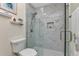 Updated bathroom with walk-in shower, marble tile, and modern fixtures at 286 Mark Twain Ln, Rotonda West, FL 33947