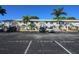 Exterior of condo building with guest parking at 26485 Rampart Blvd # D6, Punta Gorda, FL 33983