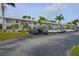 Exterior of condo building with parking and landscaping at 26485 Rampart Blvd # D6, Punta Gorda, FL 33983
