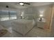 Main bedroom with white platform bed and ample storage at 26485 Rampart Blvd # D6, Punta Gorda, FL 33983