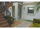 Condo building entrance with stairs and walkway to unit at 26485 Rampart Blvd # D6, Punta Gorda, FL 33983