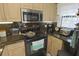 Updated kitchen with granite countertops and stainless steel appliances at 26485 Rampart Blvd # D6, Punta Gorda, FL 33983