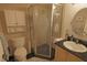 Clean bathroom with a shower stall, toilet, and vanity with granite countertop at 26485 Rampart Blvd # D6, Punta Gorda, FL 33983