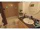 Clean bathroom with tub, shower, and granite vanity at 26485 Rampart Blvd # D6, Punta Gorda, FL 33983