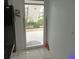 View of condo's front door leading to patio and parking lot at 26485 Rampart Blvd # D6, Punta Gorda, FL 33983