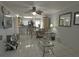 Open concept living room with tile floors and kitchen view at 26485 Rampart Blvd # D6, Punta Gorda, FL 33983