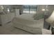 Bedroom with white platform bed and dresser at 26485 Rampart Blvd # D6, Punta Gorda, FL 33983