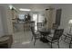 Condo kitchen with granite counters, dining area, and view of patio at 26485 Rampart Blvd # D6, Punta Gorda, FL 33983