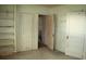 Spacious bedroom with built-in shelving and doors at 702 W Olympia Ave, Punta Gorda, FL 33950