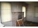 This living room features a brick fireplace and needs renovation at 702 W Olympia Ave, Punta Gorda, FL 33950