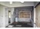 Dated kitchen with exposed plumbing and boarded-up window needs renovation at 702 W Olympia Ave, Punta Gorda, FL 33950