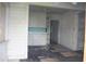 A dated kitchen with white cabinets and turquoise tile backsplash needs renovation at 702 W Olympia Ave, Punta Gorda, FL 33950