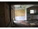 A fixer-upper kitchen with white cabinets and damaged flooring at 702 W Olympia Ave, Punta Gorda, FL 33950