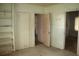 Bedroom with built-in shelving and access to other rooms at 702 W Olympia Ave, Punta Gorda, FL 33950