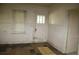 An entryway with a door to the outside needs renovation and updating at 702 W Olympia Ave, Punta Gorda, FL 33950